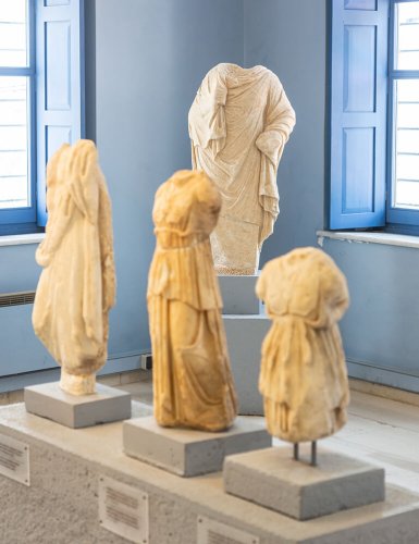 ancient statues without heads in museum 