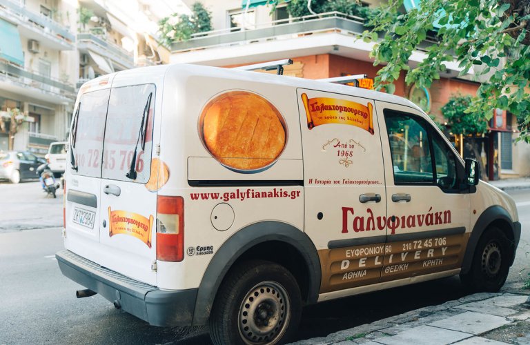 A Galifianaki pastry shop van parked on a street in Athens. 