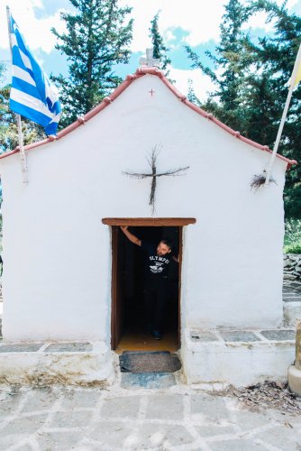 a small white church atop Mount Pendeli in Athens