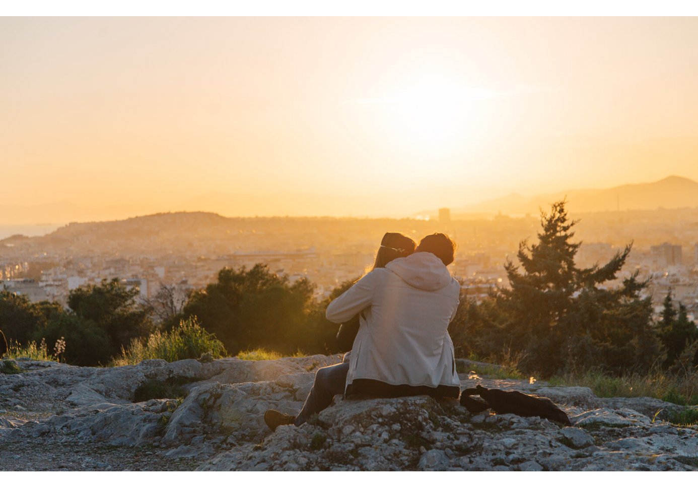 a couple hugging during sunset in Athens