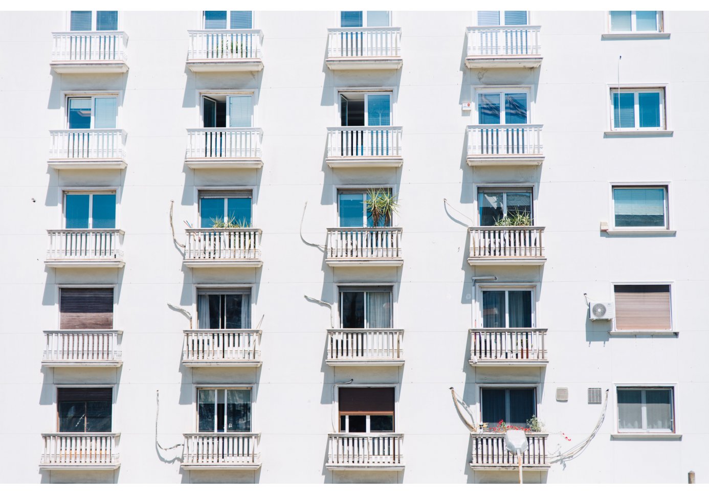 A shots of windows on an apartment block in Athens