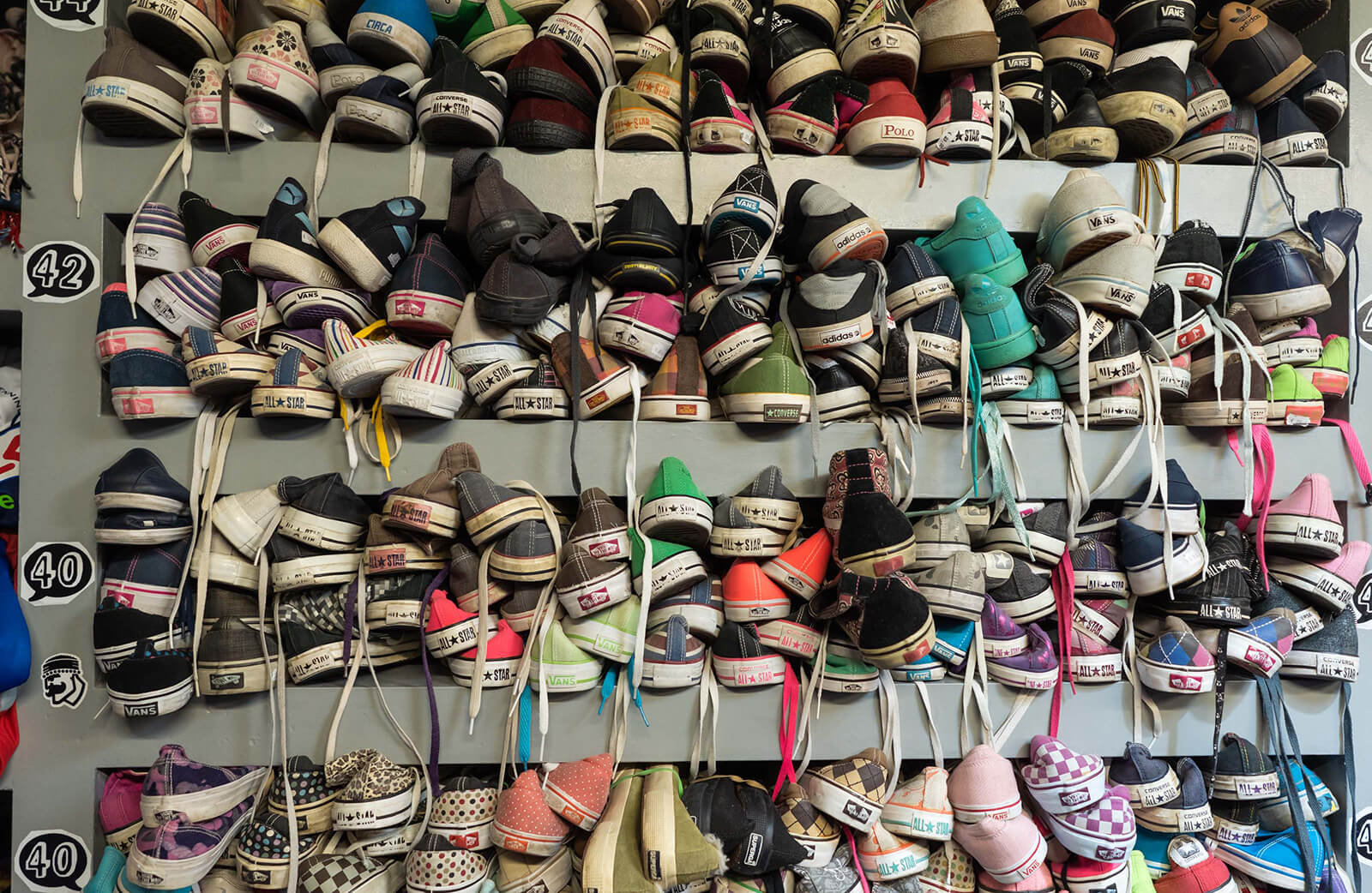 Secondhand shoes stacked high in Exarchia. | Photo: Orestis Seferoglou 