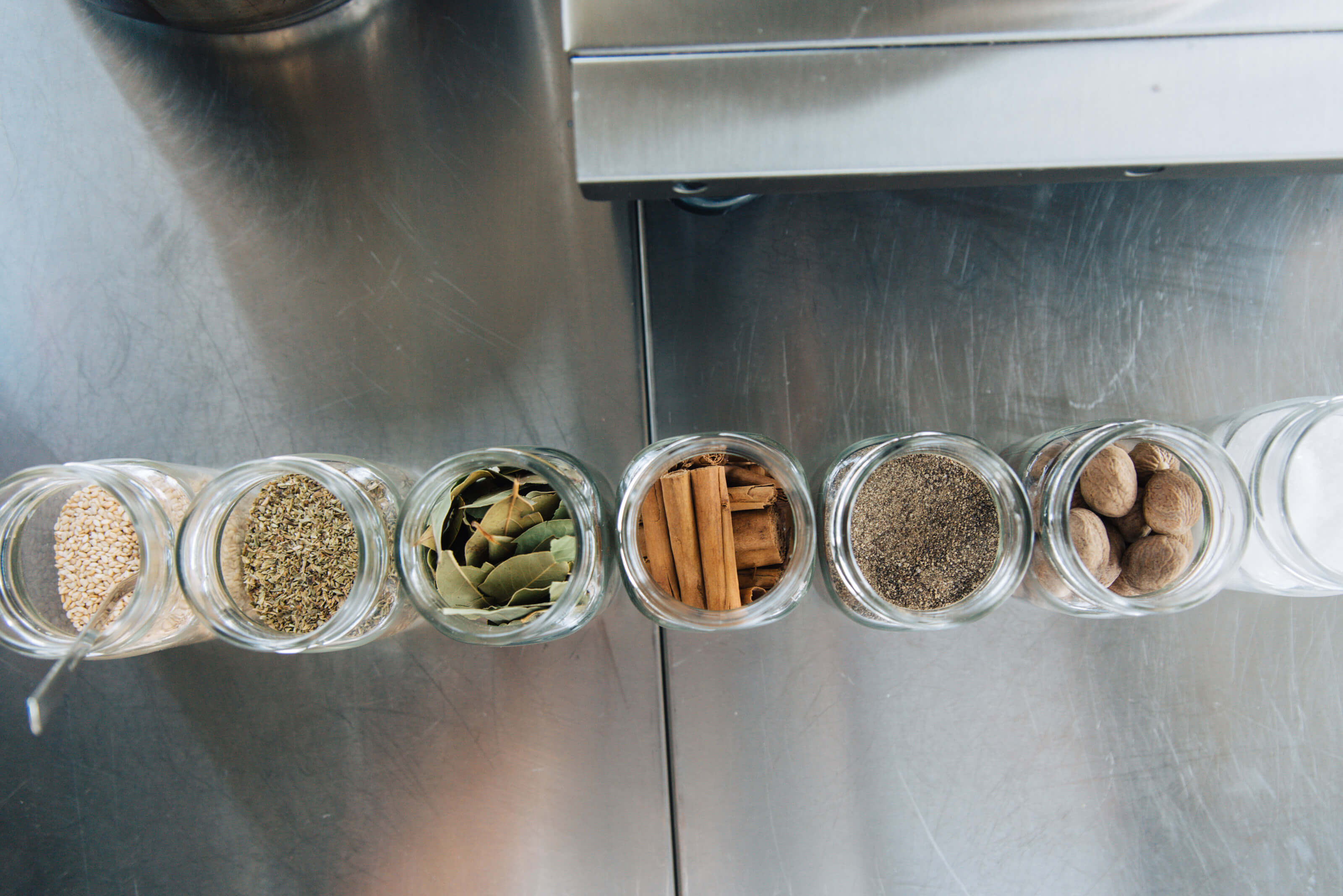 Sesame seeds, oregano, bay leaves, cinnamon sticks, pepper, nutmeg, salt. | Photo: Thomas Gravanis 