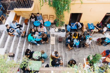 People sitting at Mnisikleous Street in Plaka