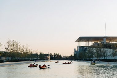 People kayaking at the SNFCC canal in Athens