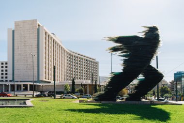 Runner statue in front of the Hilton Hotel in Athens