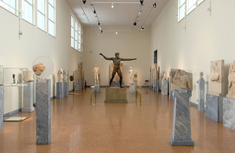 The classical sculpture hall with a bronze statue of Zeus or Odysseus as the main exhibit. | Courtesy: National Archaelogical Museum