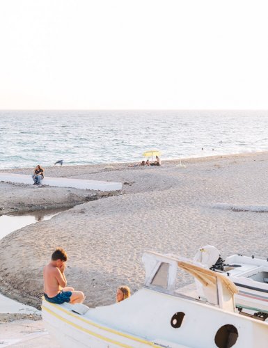 Child playing on beach in Faliro, Athens