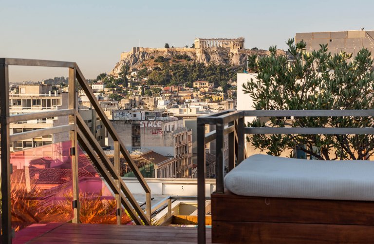 A shot of the Acropolis from a rooftop pool bar