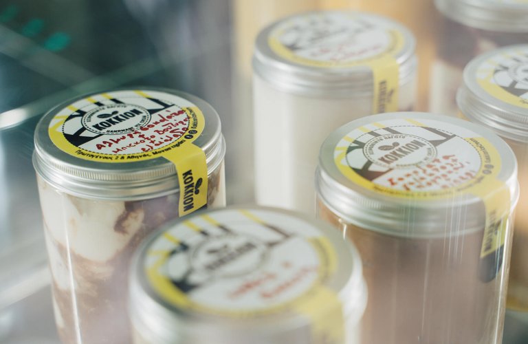jars of ice cream in a glass display