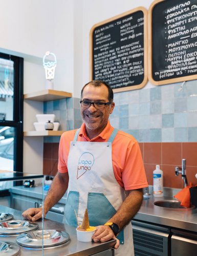 an ice cream parlour employee smiling