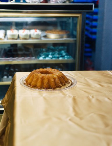 A ravani dessert on a table in a bakery in Athens. 