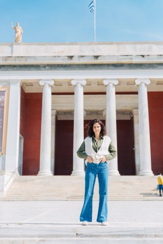 A woman in front of the National Technical University of Athens