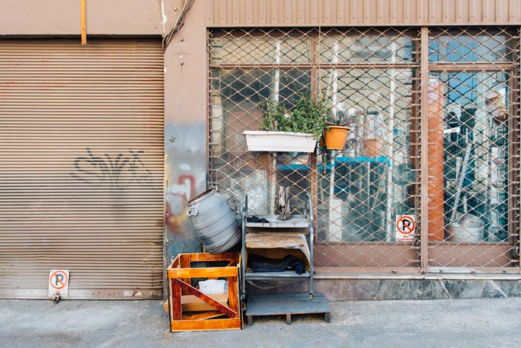 stacked junk outside an old store