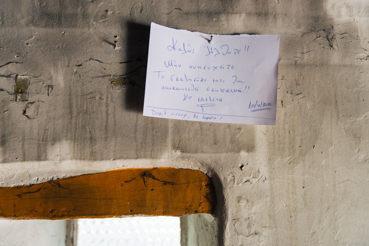 a handwritten note inside a church at Mount Pendeli in Athens