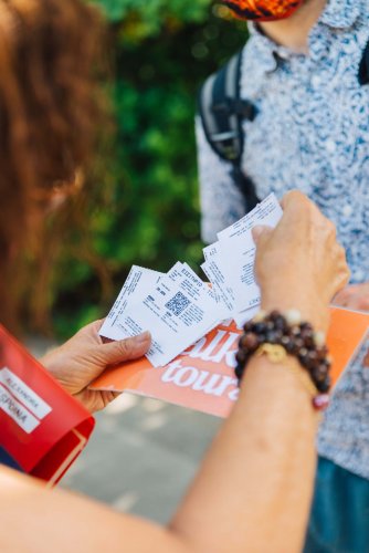 a woman sorting out tickets in her hands