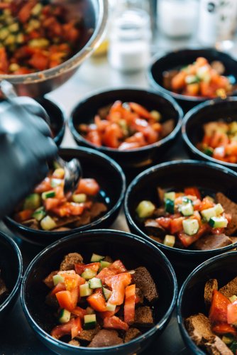 bowls of saland with tomato, cucumber and rusks