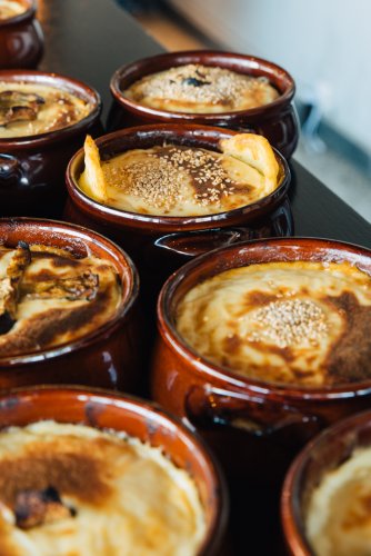 eight individual moussaka pots.