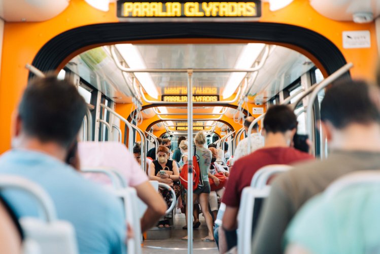 passengers in an orange tram.