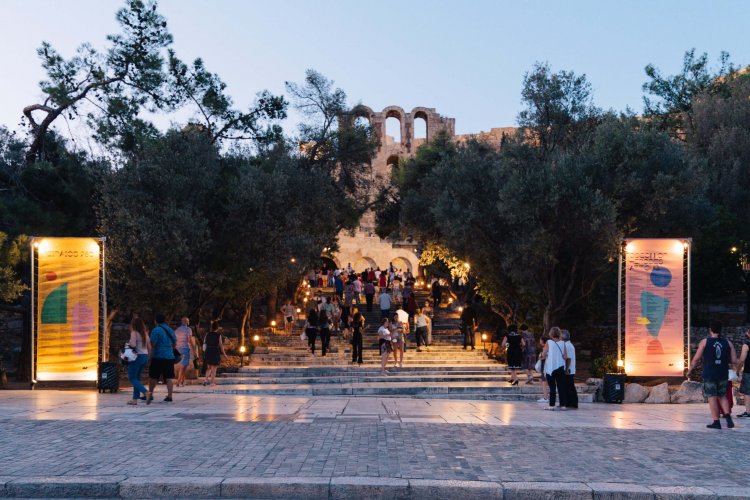 crowd ascending the Herodeion's entrance stairs.