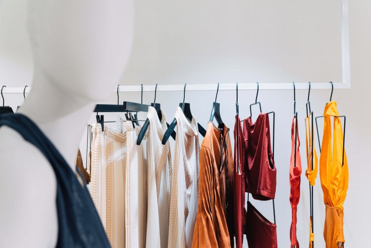 colourful pieces of clothing hanging from a rack