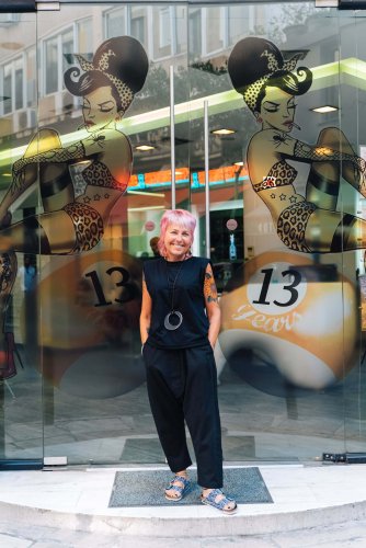 the owner of Lemon Poppy Seed in front of her shop. 