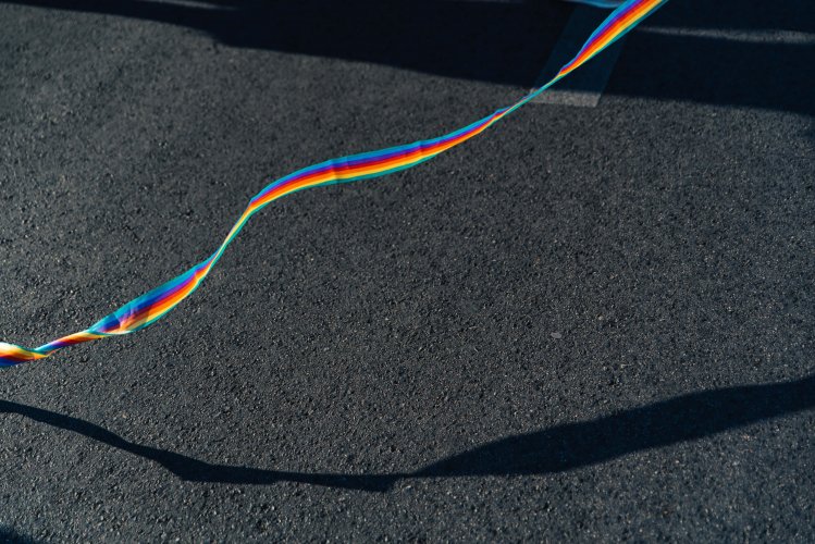 a rainbow ribbon on the street.