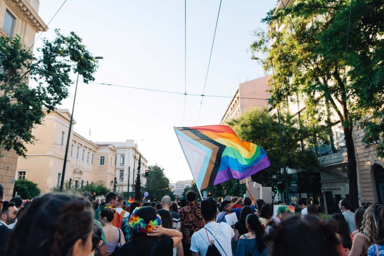 Marchers weaving an LGBT flag at the parade.