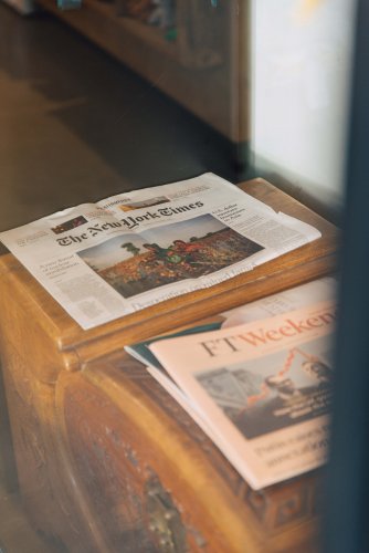 The New York Times and the FTWeekend newspapers on a counter. 