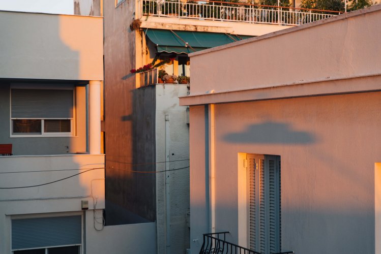 Shadows on houses' walls during sunset. 