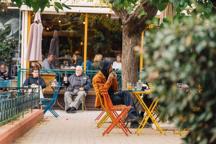 people sitting outdoors at coffee shops