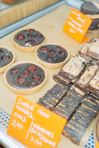 Tarts and energy bars on a counter. 
