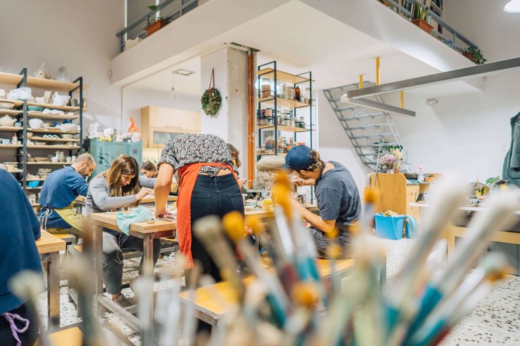 people making ceramics in a pottery lab