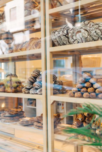 a window display with bread and pastry.