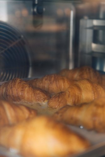 croissants in the making at the oven.