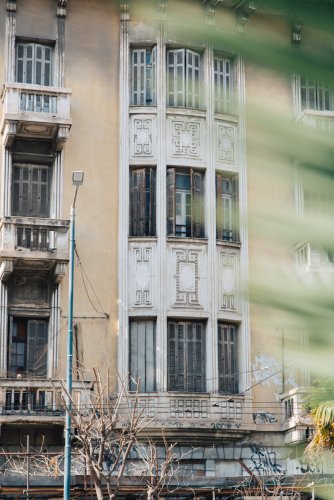 an ornamented facade of an old building.