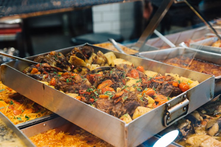 a window display with cooked food. 