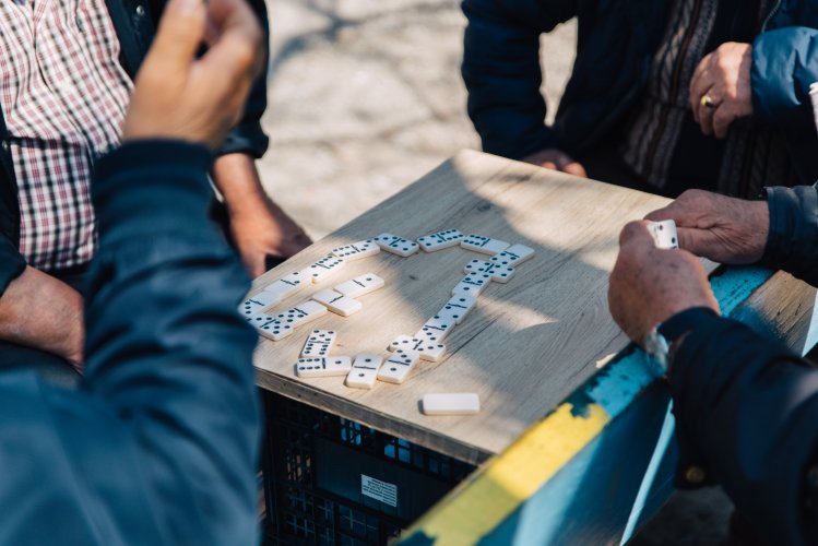 men playing domino at a diy table.