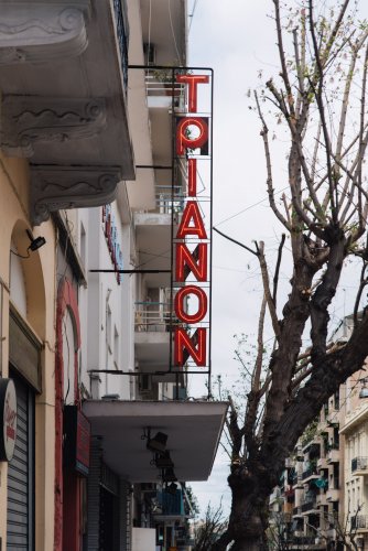 the red sign of a cinema that reads "trianon"