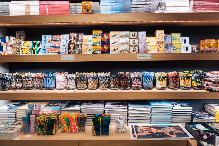 Stationery displayed on four shelves.