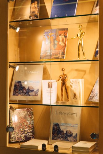 books and figurines in a window display.