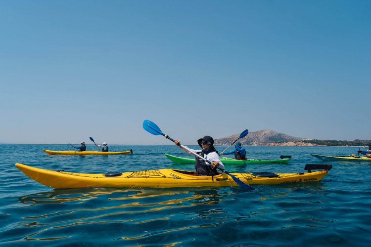 people kayaking in the sea.