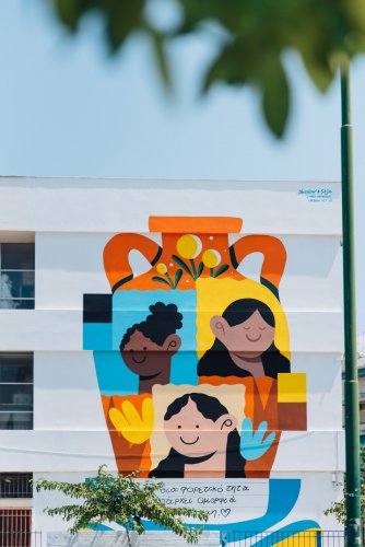 a colourful mural depicting kids of different races.