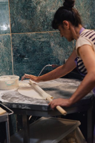 a woman opening a dough.