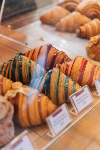 a window display with croissants.