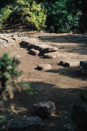 remains of an ancient structure in a park. 