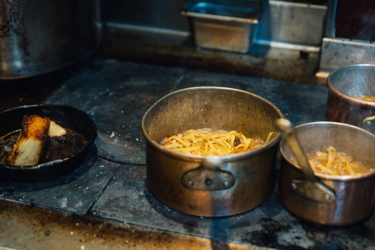 Pots with pasta on a stovetop.