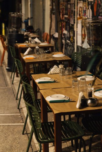 A row of set outdoor tables.