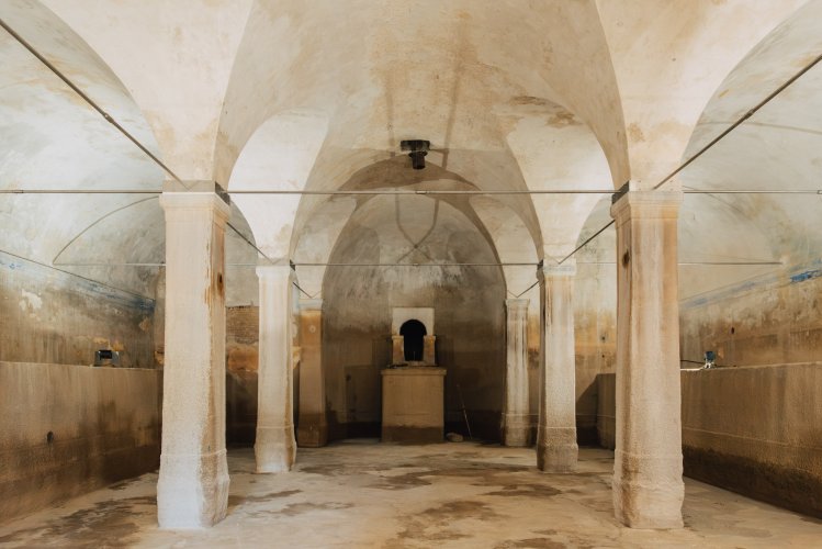 Light filters into the empty reservoir, highlighting centuries-old stonework once filled with flowing water. | Photo: Thomas Gravanis