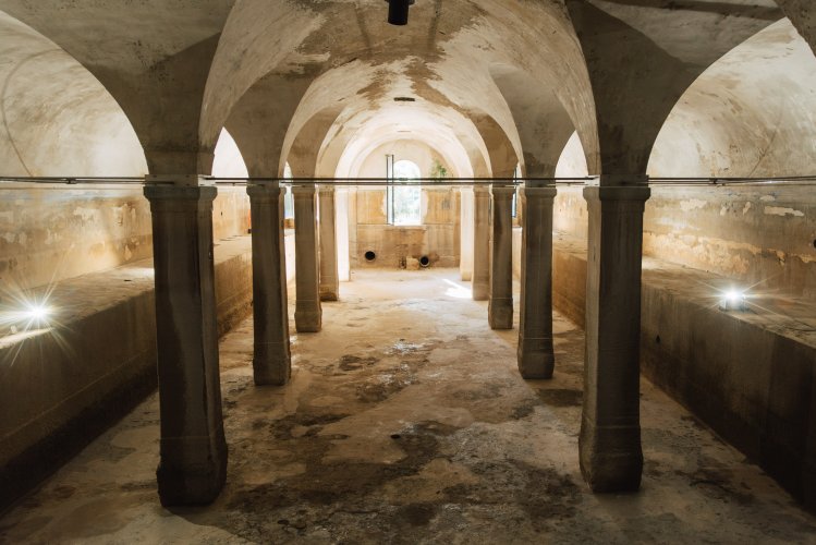 An unassuming doorway opens onto one of Europe’s longest underground aqueducts. | Photo: Thomas Gravanis